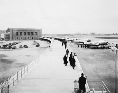 Wurts Bros. - Promenade, LaGuardia Airport, planes loading and discharging passengers, 1944